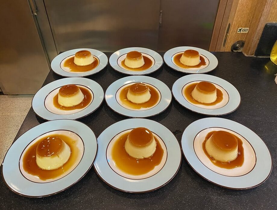Matching individual portions arranged on white plates across a table.