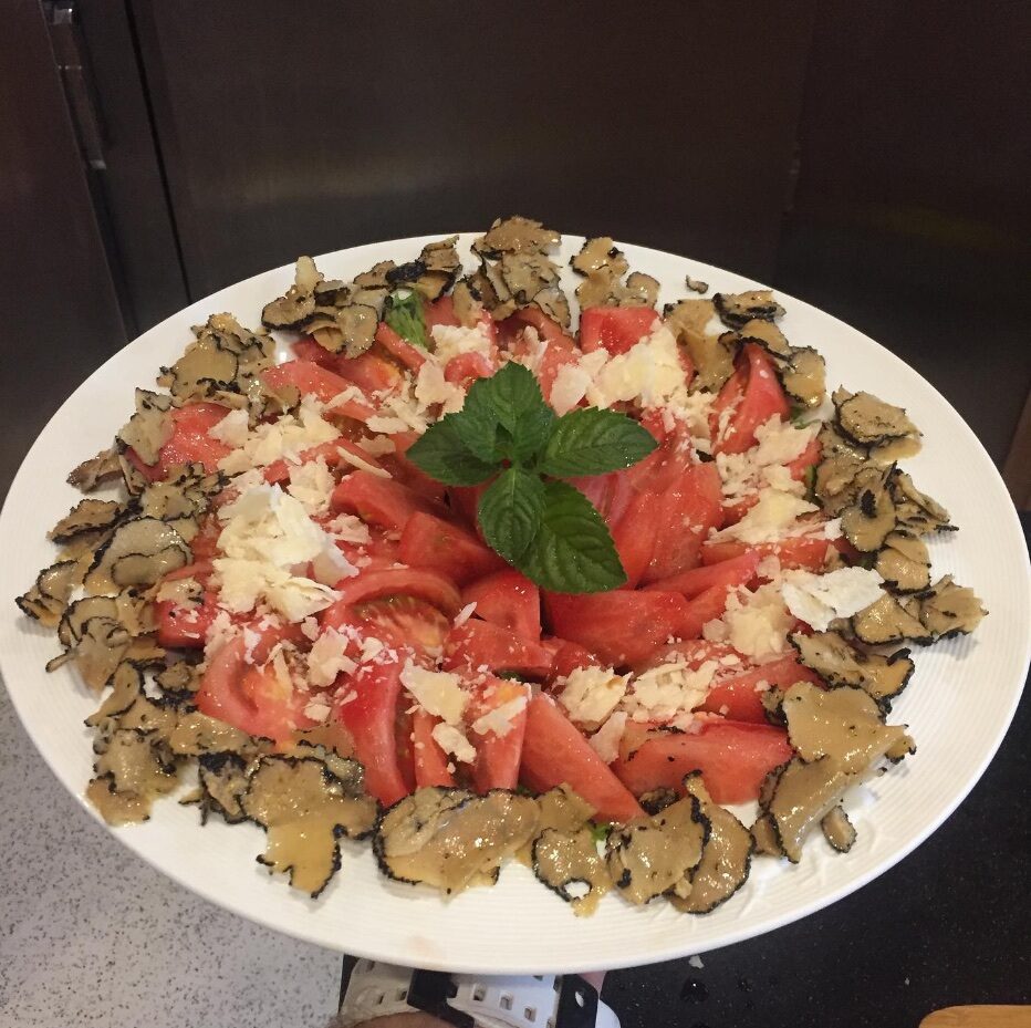 A large white platter with red and white pieces arranged at the centre.