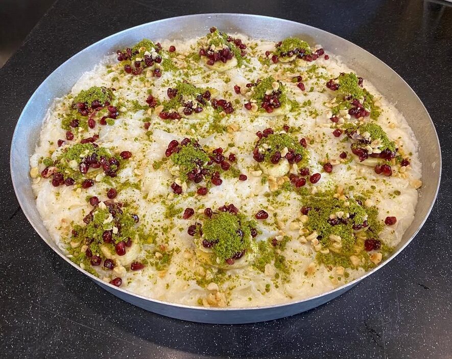 A presentation in a wide round dish topped with small colourful pieces.
